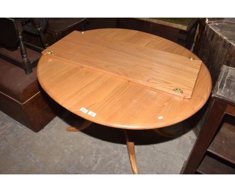 An Ercol light elm oval extending kitchen table.111cm extends to 150cmHeight 72cmWidth 98cm. 