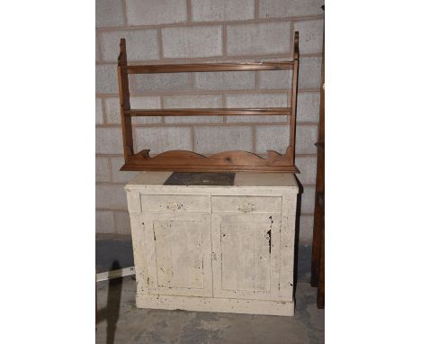 A painted Victorian two door cupboard and a pine wall shelf. (2) 