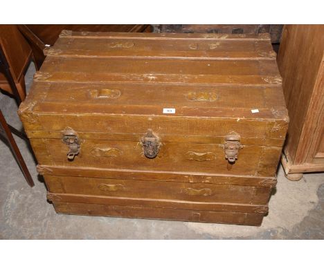 An early 20th Century scumbled domed and slatted trunk. 