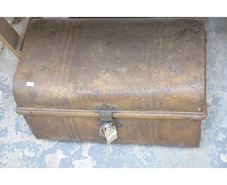A vintage domed tin trunk. 