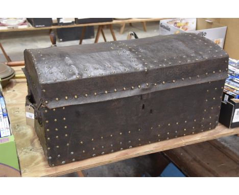 A 19th Century studded leather domed trunk. 