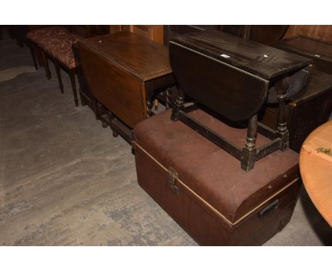 A scumbled domed tin trunk, a small oak drop leaf occasional table and a 1930s oak barley twist drop leaf dining table. (3) 