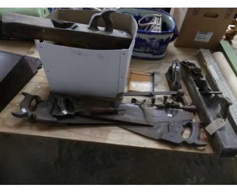 A large collection of various carpentry tools Including various planes, saws, etc. (qty) 