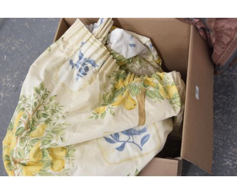 A collection of floral and fruit pattern curtains with tie backs. 