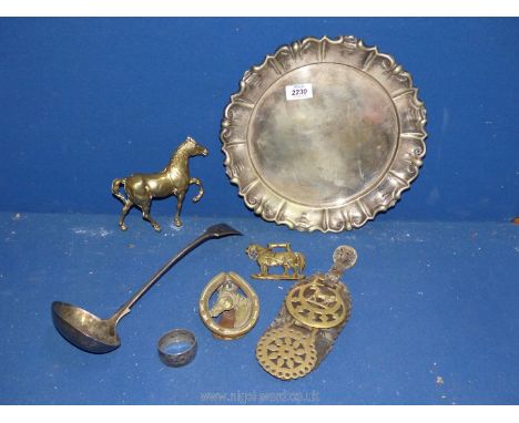 A circular epns tray, ladle, brass horse, door knocker, horse brasses, etc,