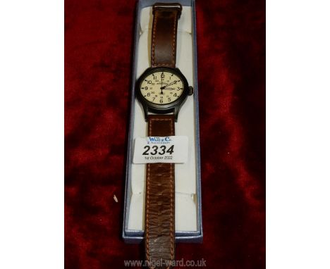 A Timex Expedition Indiglo WR50M watch with leather strap.