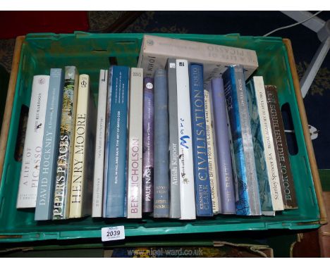 A crate of books including A Life of Picasso, Henry Moore, David Hockney, etc.