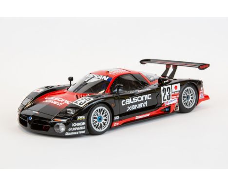 A 1:18 Autoart Signature series Nissan R390 GT1 #23 Le Mans 1997. In black and red racing livery, drivers K. Hoshino/E. Comas