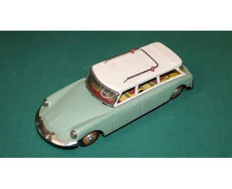 A scarce early 1960's SFTF tinplate 1:24 scale friction powered model of a Citroen ID19 DS Safari. In sage green with white r