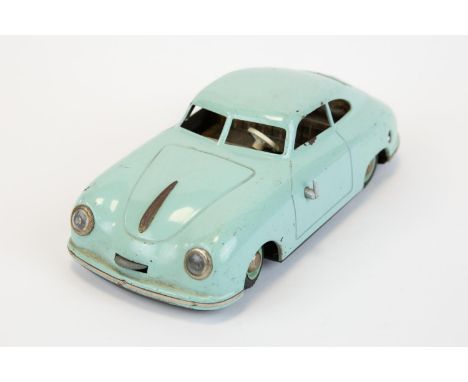 A scarce JNF prototyp Porsche, tin plate clockwork model car in light blue. Made in Germany US zone, dating from the 1950s. L