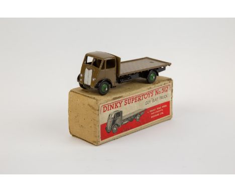 Dinky Supertoys Guy Flat Truck (512). A scarce very early example in khaki cab and flatbed with black chassis and wings and g