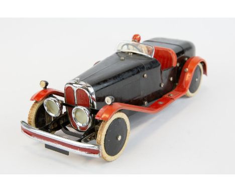 A rare 1930's No.2 Meccano Constructor Car. An example in black with red mudguards/running boards, red seats, black wheels wi