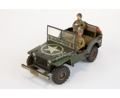 A scarce Arnold made in Germany model of a Willys jeep. Military police issue, body work finished in Khaki green, with rubber