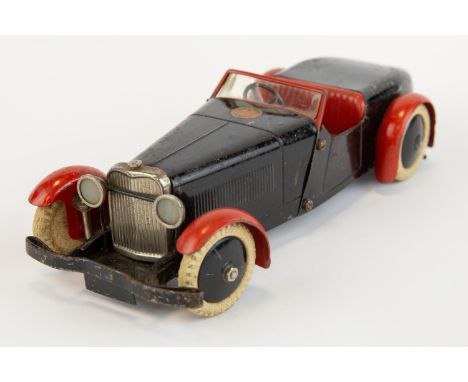 A scarce 1930's No.1 Meccano Constructor Car. An example in black with red mudguards, red seats, black wheels with white Mecc
