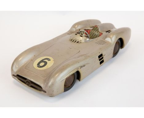 A scarce JNF Joseph Neuhierl tin friction Mercedes Benz W196 silver arrow with racing No. 6 transfer applied to bonnet. Made 