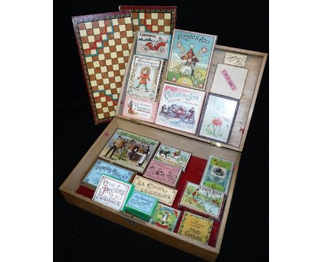 AN EARLY 20TH CENTURY FRENCH 'JEUX NOUVEAUX' WOODEN TOY COMPENDIUM BOX, containing a good collection of period boxed games, i