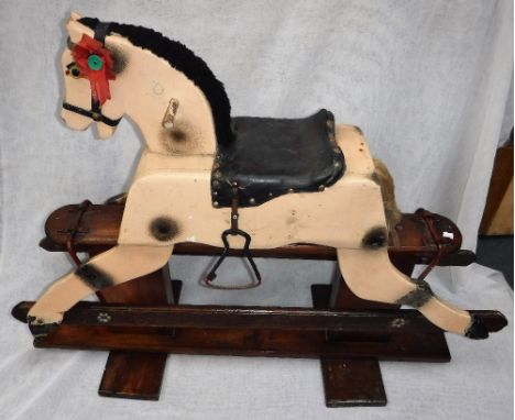 A 1930S VINTAGE WOODEN ROCKING HORSE, with safety action, with cream and dappled coat 30" high x 40" long (overall)
