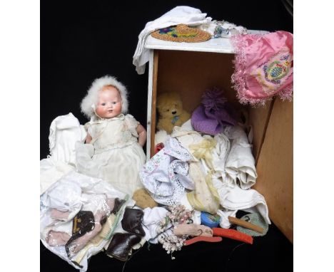 A VINTAGE CERAMIC HEADED DOLL, with a large collection of accessories, including many outfits, clothes brushes, miniature woo