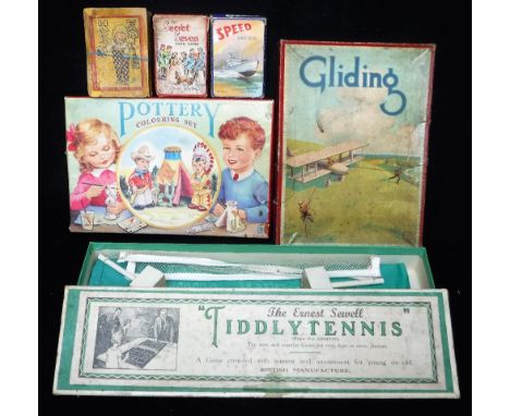 THE ERNEST SEWELL 'TIDDLYTENNIS' an early Chad Valley 'Gliding' game, a pottery colouring set and three sets of Vintage cards