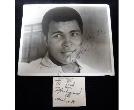 CASSIUS CLAY (MUHAMMED ALI): A SIGNED BLACK AND WHITE PHOTOGRAPH; Inscribed; ' M Ali Cassius Ali Clay S R To Dick' and a sign