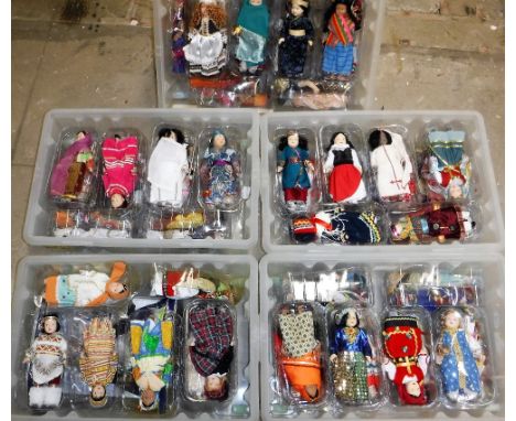 A LARGE COLLECTION OF DOLLS from around the world, each with ceramic heads and dressed in national costume and a Millennium '