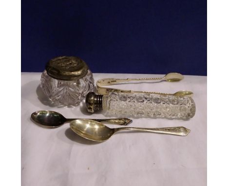 Sterling silver sugar tongs and two sterling silver tea/coffee spoons with a glass pot and scent bottle with silver tops comb