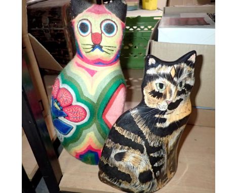 Ceramic Cats by Nina cat and a wooden cat figure with a multi coloured wool covering, largest H: 36 cm. Not available for in-