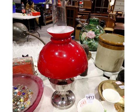 Chrome oil lamp with chimney and ruby glass shade, H: 60 cm. Not available for in-house P&amp;P