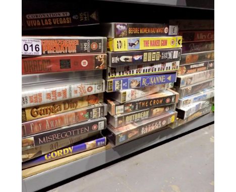 Shelf of classic VHS tapes to include Dragon, Predator and Blood Sport. Not available for in-house P&amp;P