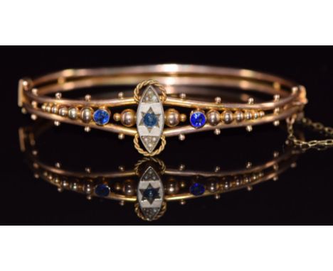 Edwardian 9ct gold bangle set with a sapphire, paste and seed pearls with rope twist and sphere decoration, 7.7g&nbsp;