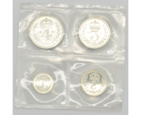 1989 Queen Elizabeth II Maundy set, first bust, in white leather pouch