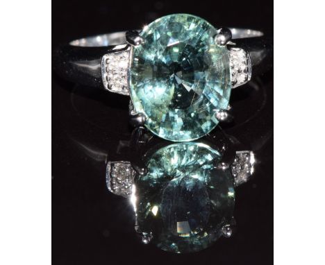 An 18ct white gold ring set with paraiba tourmaline and diamonds, 6.0g, size M/N