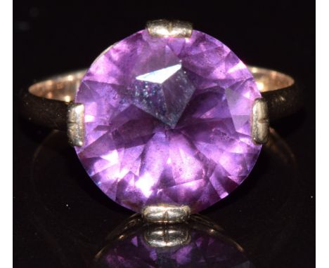 A 9ct gold ring set with a synthetic purple sapphire, 4.7g , size T