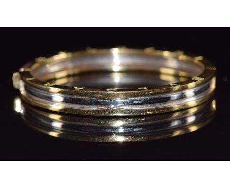 A 14k gold bi-coloured bangle, 27.2g&nbsp;