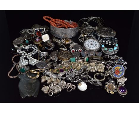 A collection of silver jewellery including bangle, charm bracelet, scarf clip, brooches, lockets, rings, Art Deco clip, coral