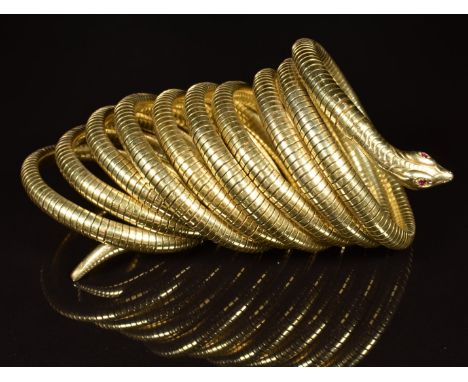 Silver gilt 800 grade cuff/ bangle in the form of a snake set with garnet eyes, maker ST, used in the filming of Bedazzled wi