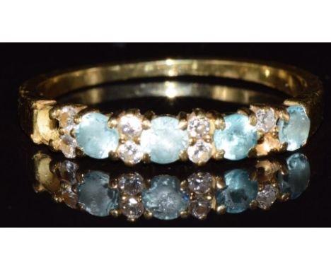 An 18ct gold ring set with topaz and diamonds (two stones missing), 2.5g, size N