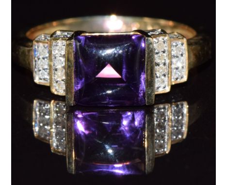 A 9ct gold ring set with a rectangular amethyst cabochon and diamonds, 3.2g, size N
