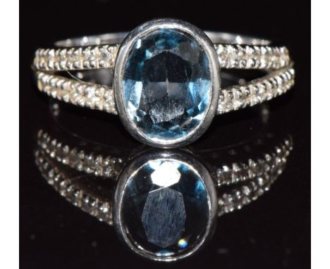 A 9ct white gold ring set with topaz, 3.9g, size M/N