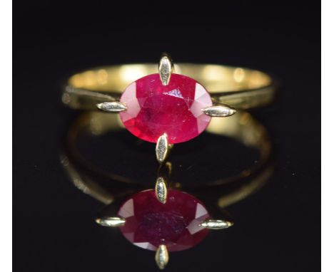 An 18ct gold ring set with an oval cut ruby of approximately 1.5ct, 3.7g, size M/N