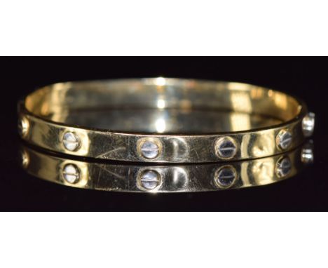 A 14k gold bi-coloured bangle, 9.7g&nbsp;
