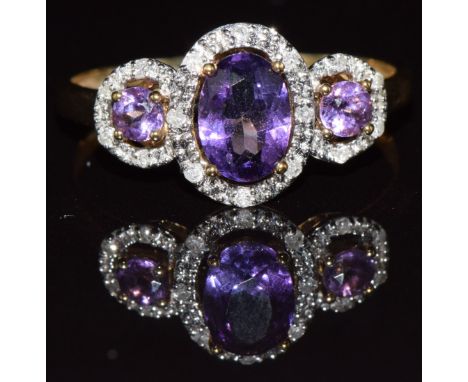 A 9k gold ring set with amethysts and diamonds, 1.9g, size Q