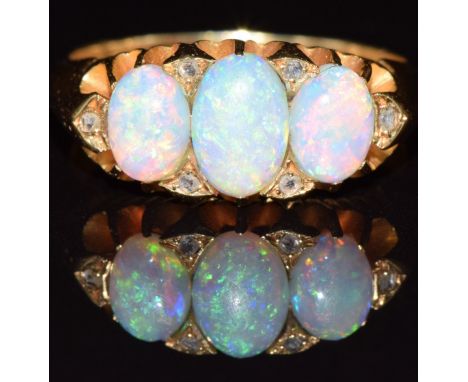 Edwardian 18ct gold ring set with three opal cabochons and rose cut diamonds, Birmingham 1903, 5.7g, size O