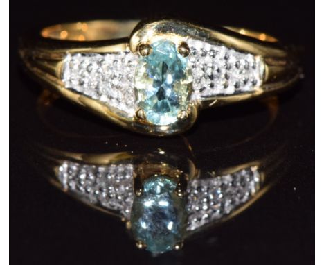 An 18ct gold ring set with paraiba tourmaline and diamonds, 4.0g, size M/N