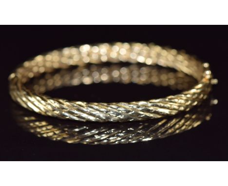 A 14k gold bangle with twist design, 16.7g&nbsp;