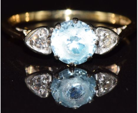 An 18ct gold ring set with topaz and diamonds, 2.6g, size N