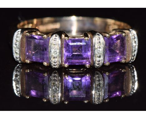 A 9ct gold ring set with amethysts and diamonds, 3.0g, size O