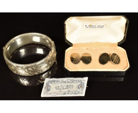 A silver bangle, silver cufflinks and brooch made from a the Potters Bar Zeppelin LZ72 (L31) with the date 1/10/16 and PB to 