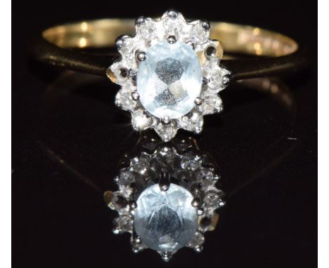 A 9ct gold ring set with aquamarine surrounded by diamonds (missing two diamonds), 1.6g, size M