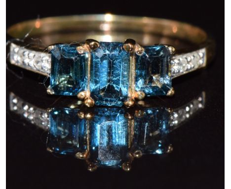 A 9ct gold ring set with topaz and diamonds, 1.4g, size K